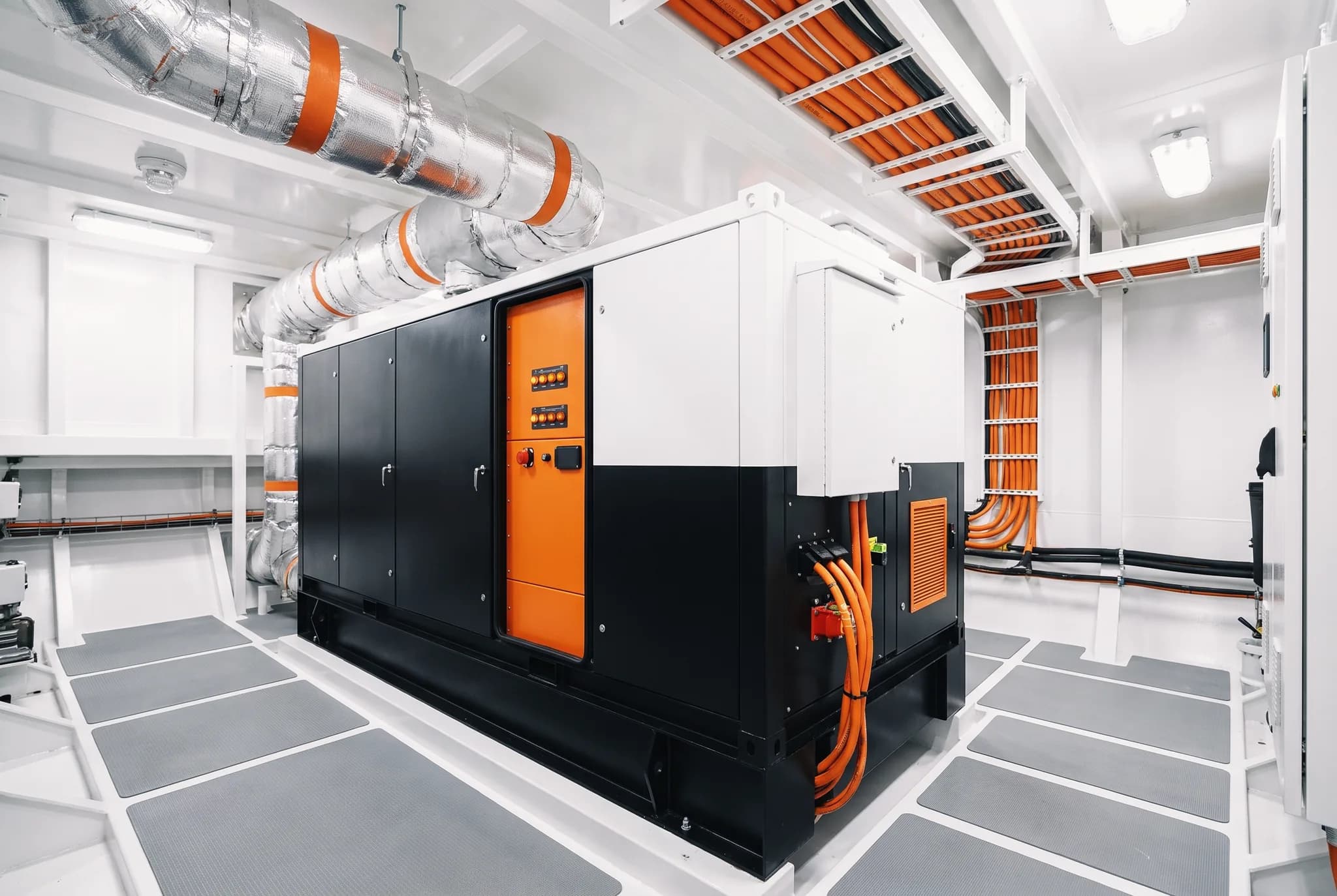 DC generator installed in a clean white vessel engine room